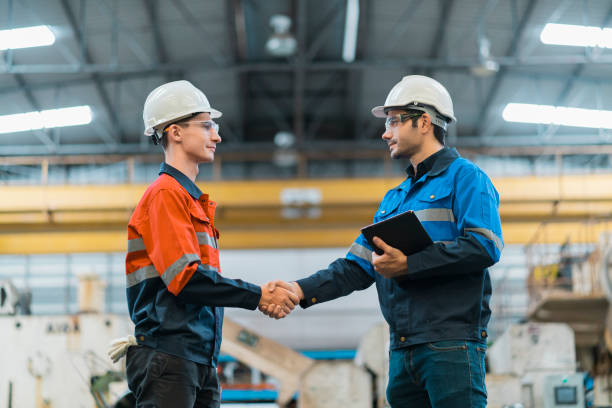 hand shake greeting of professional engineer teamwork in factory